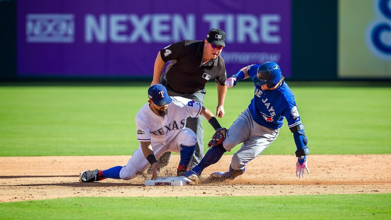 Josh Donaldson sliding into second base ahead of Rougned Odor's tag in Game 1 of the 2016 ALDS